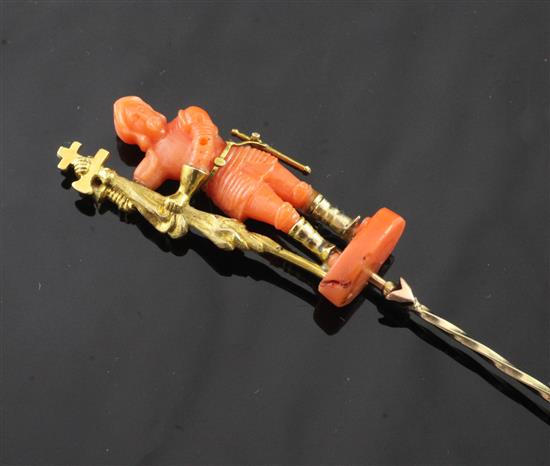 A gold and coral mounted figural tie/stick pin, 3.25in.